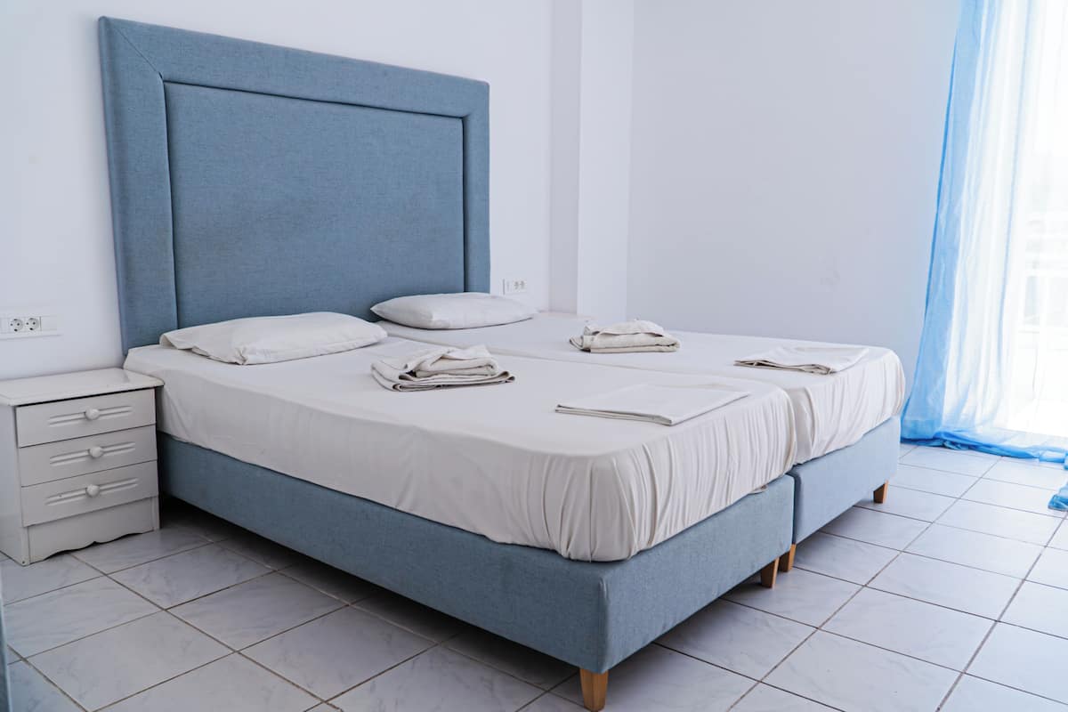 Double or Twin Room with Garden View | Iron/ironing board, bed sheets