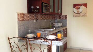 Fridge, microwave, cookware/dishes/utensils