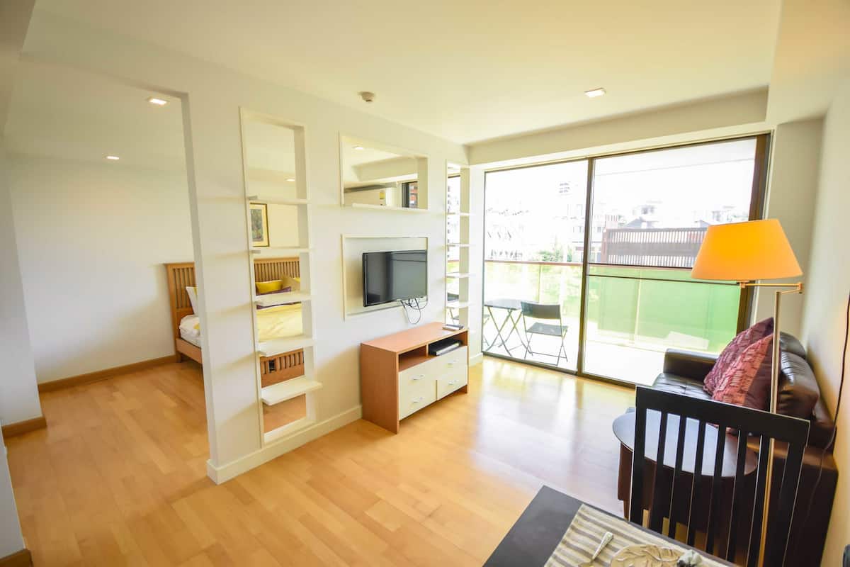 1-Bedroom Pool View Partial,Sofa Bed | Living room | 40-inch flat-screen TV with cable channels, LCD TV