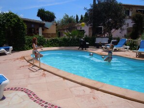 Outdoor pool, pool umbrellas, sun loungers