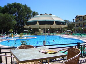 Seasonal outdoor pool, pool umbrellas, sun loungers