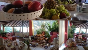 A buffet with various fruits, pastries, and a Greek yogurt station. - Damia Hotel (Corfu)