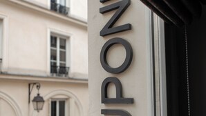 A building facade with a large, modern sign that reads "DUPONT". - Hôtel Dupond Smith (Paris)