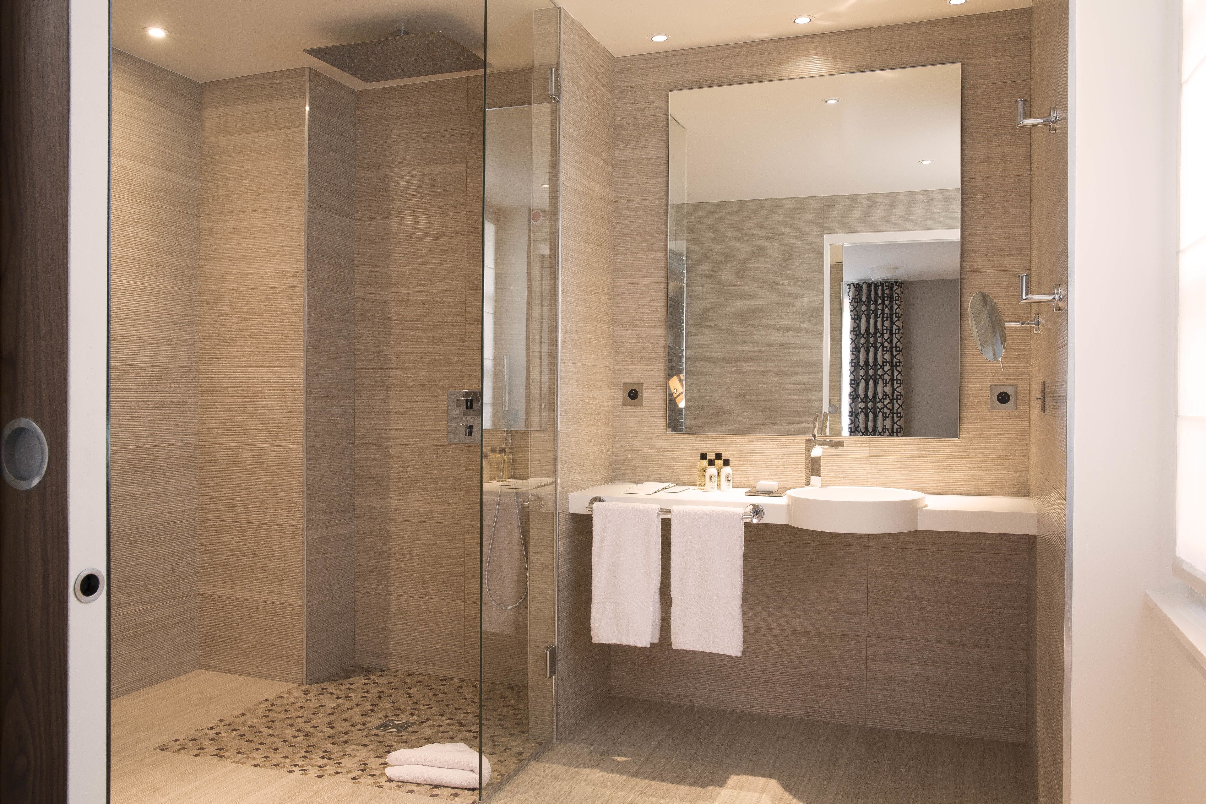 shower, rainfall showerhead, designer toiletries, hair dryer