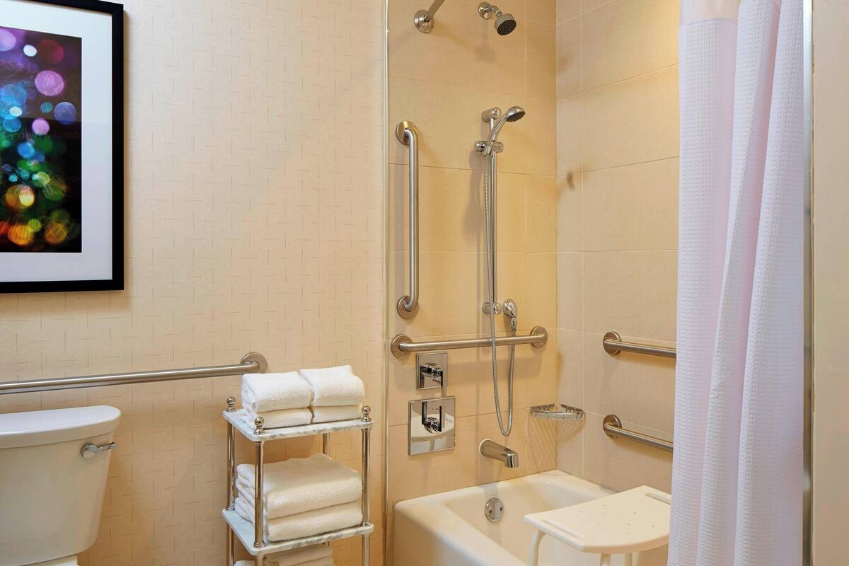 designer toiletries, hair dryer, towels, soap