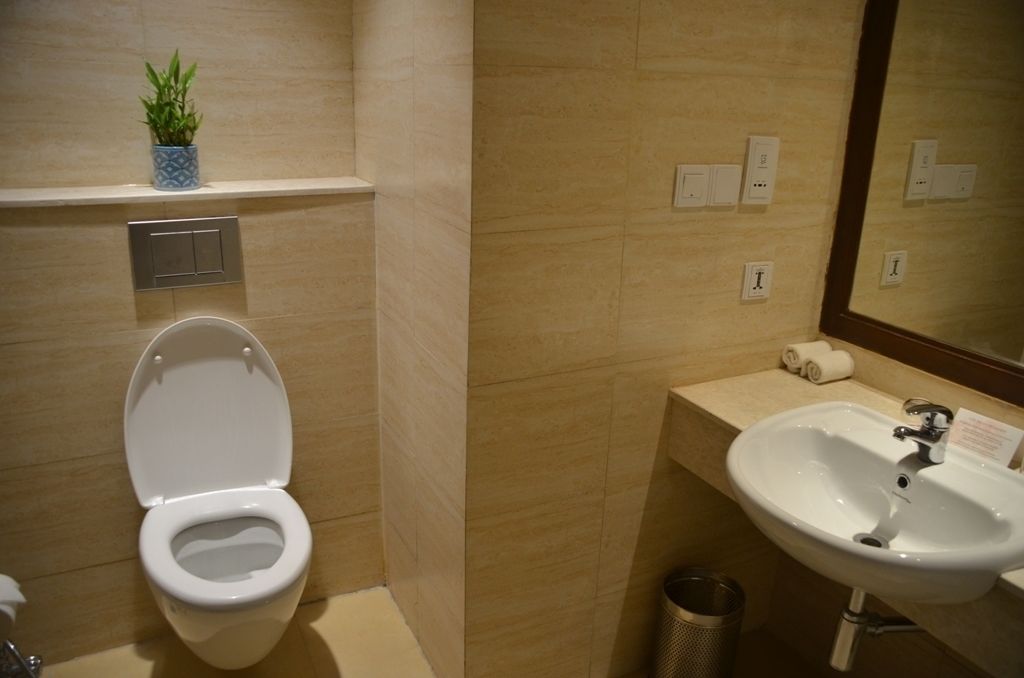 shower, hair dryer, slippers, towels