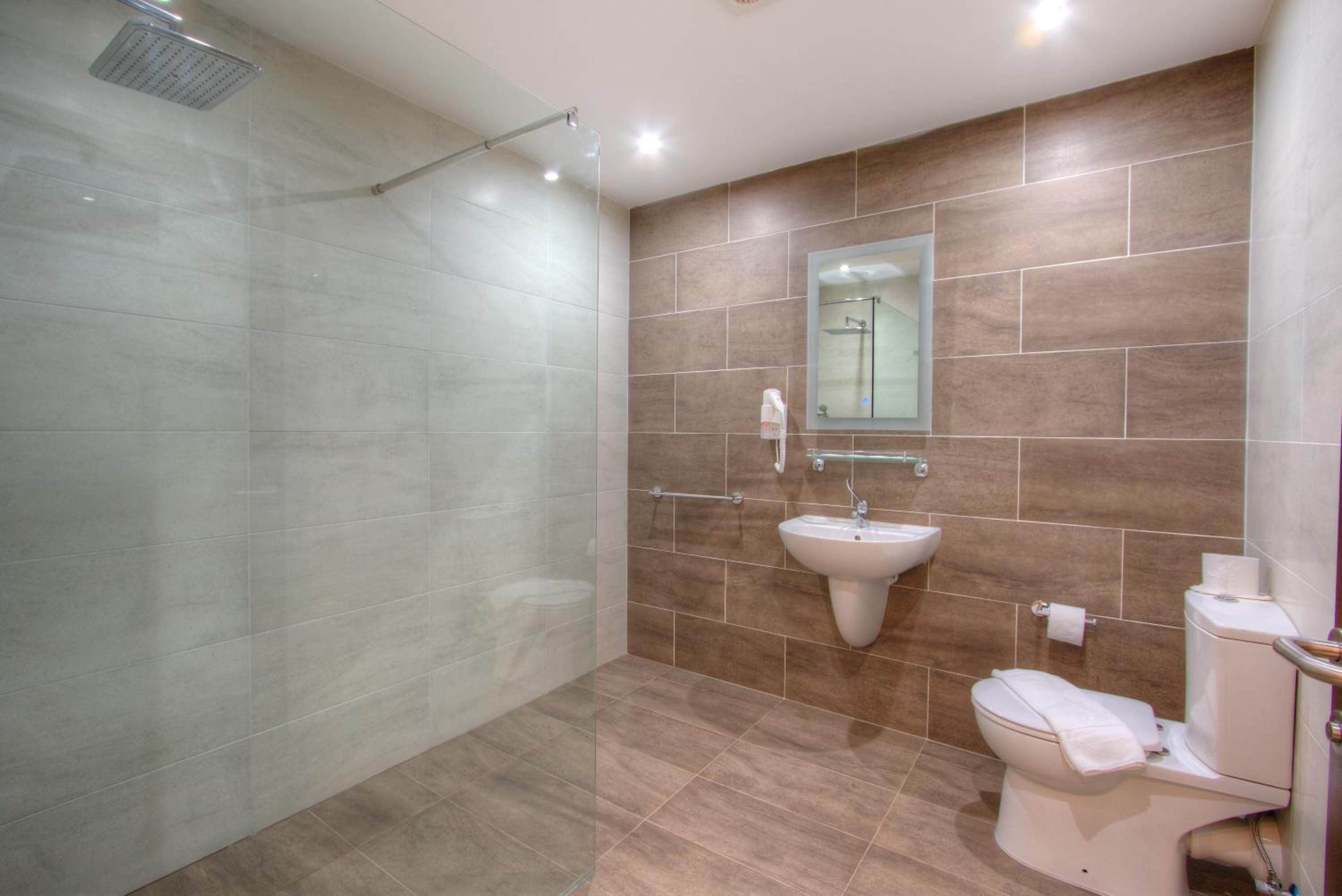 shower, hair dryer, bidet, towels