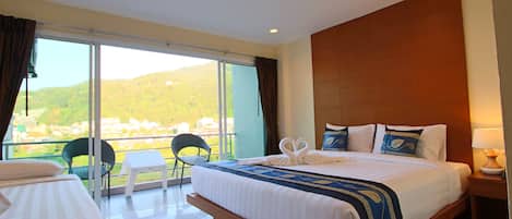 Premium Triple Room, Hill View | Minibar, in-room safe, desk, laptop workspace