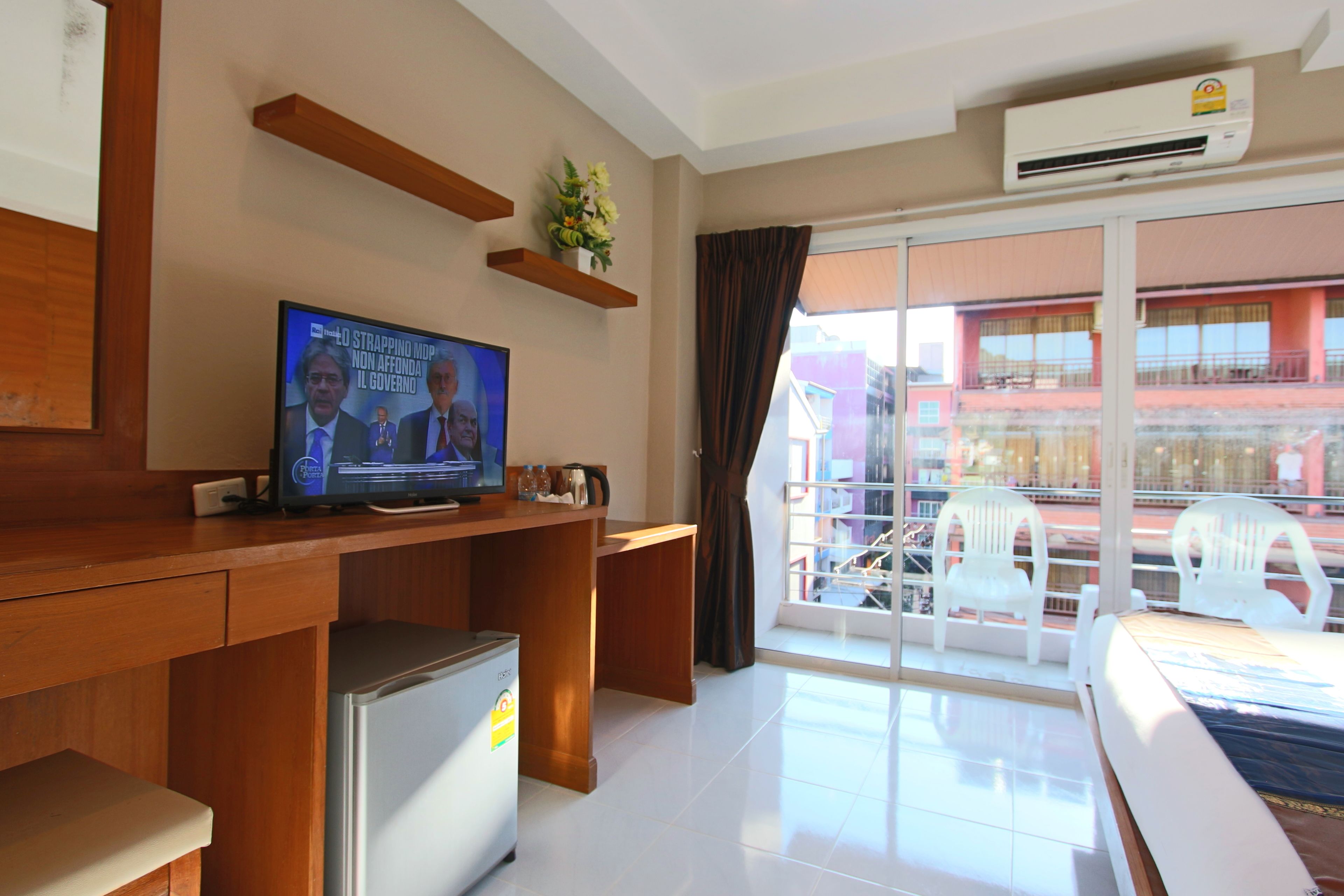 deluxe double room, 1 king bed, balcony | street view
