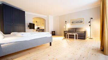 Economy Studio, City View | Living area | Flat-screen TV