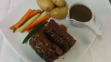 A plate with meat, potatoes, and vegetables.
