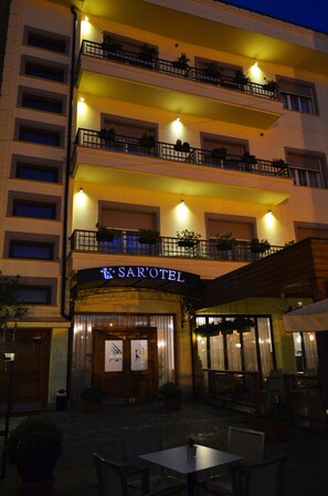A multi-story hotel with balconies, outdoor seating, and a clearly visible entrance. - Sar'Otel Boutique Hotel (Tirana)