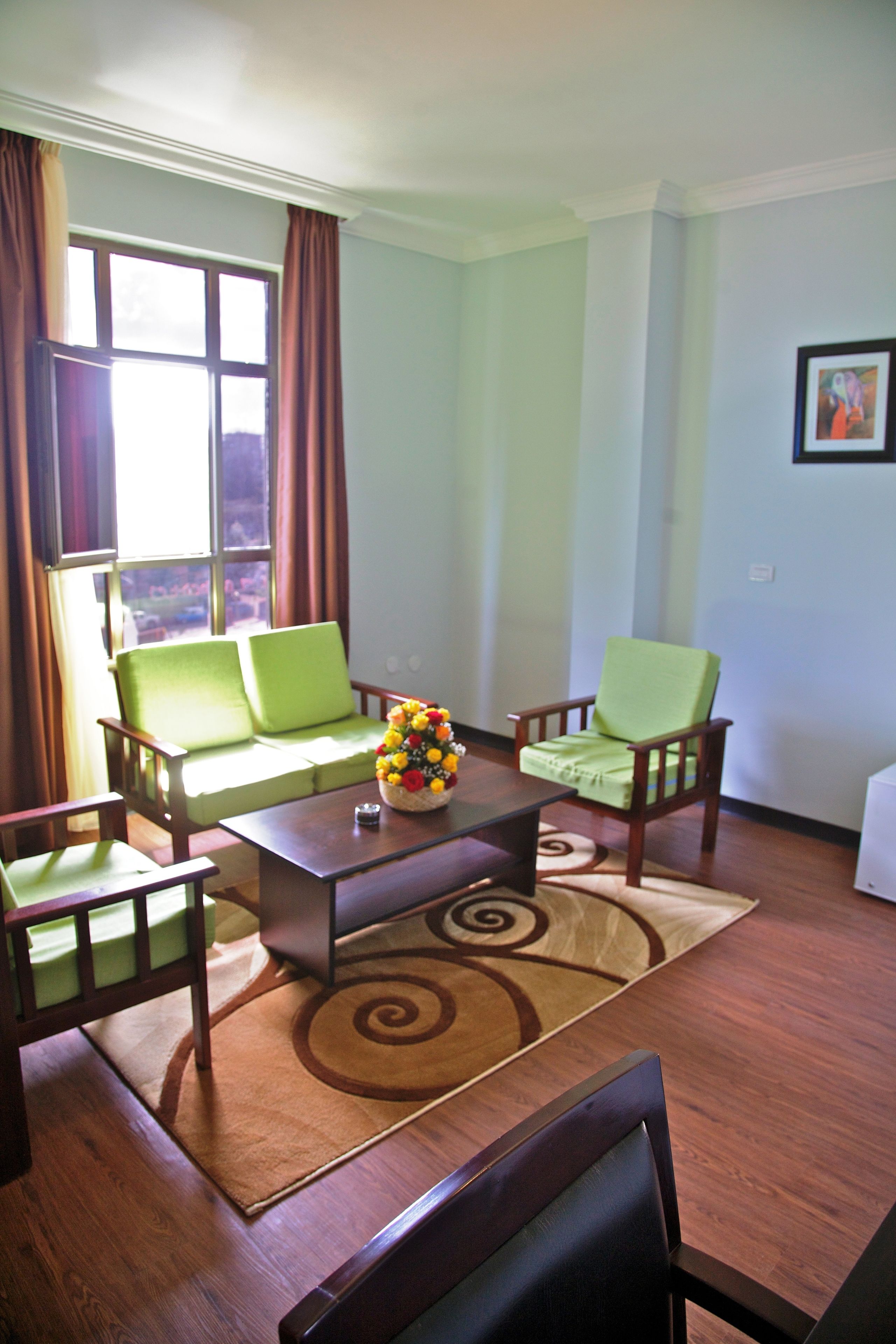 suite | living room | 32-inch led tv with satellite channels, tv, books