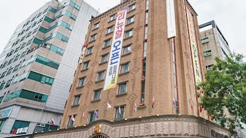 Experience the classic charm of Millennium Hotel, set amidst a vibrant urban landscape.