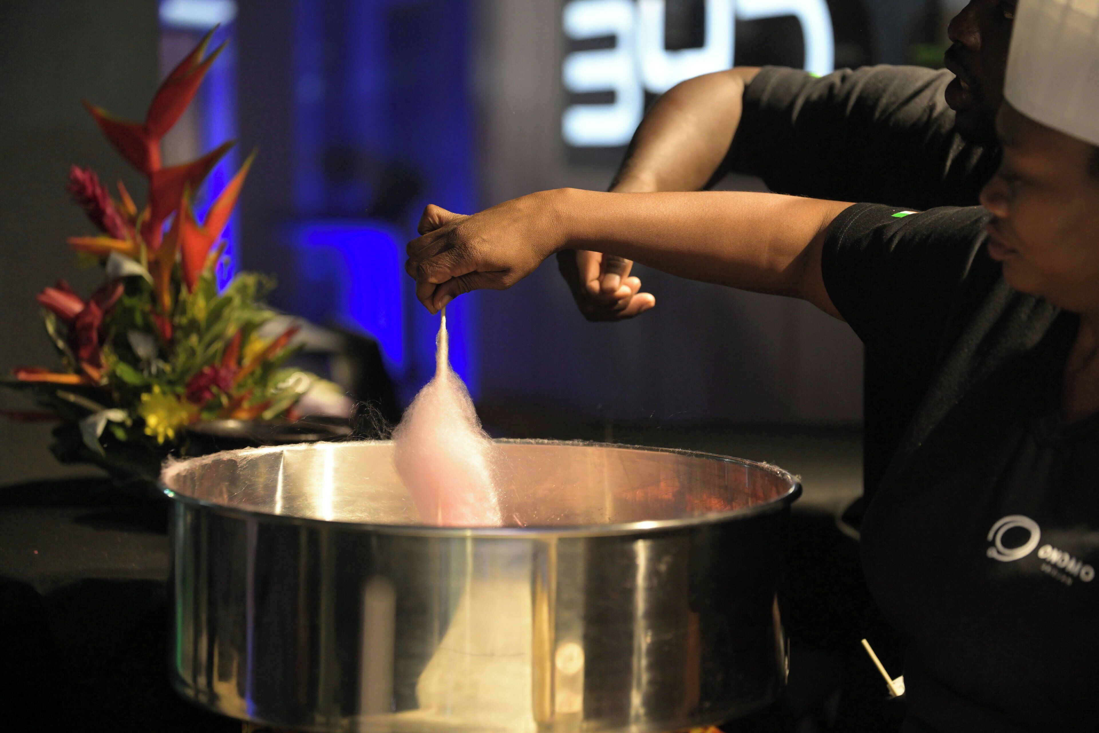 A person pouring a liquid into a pot.