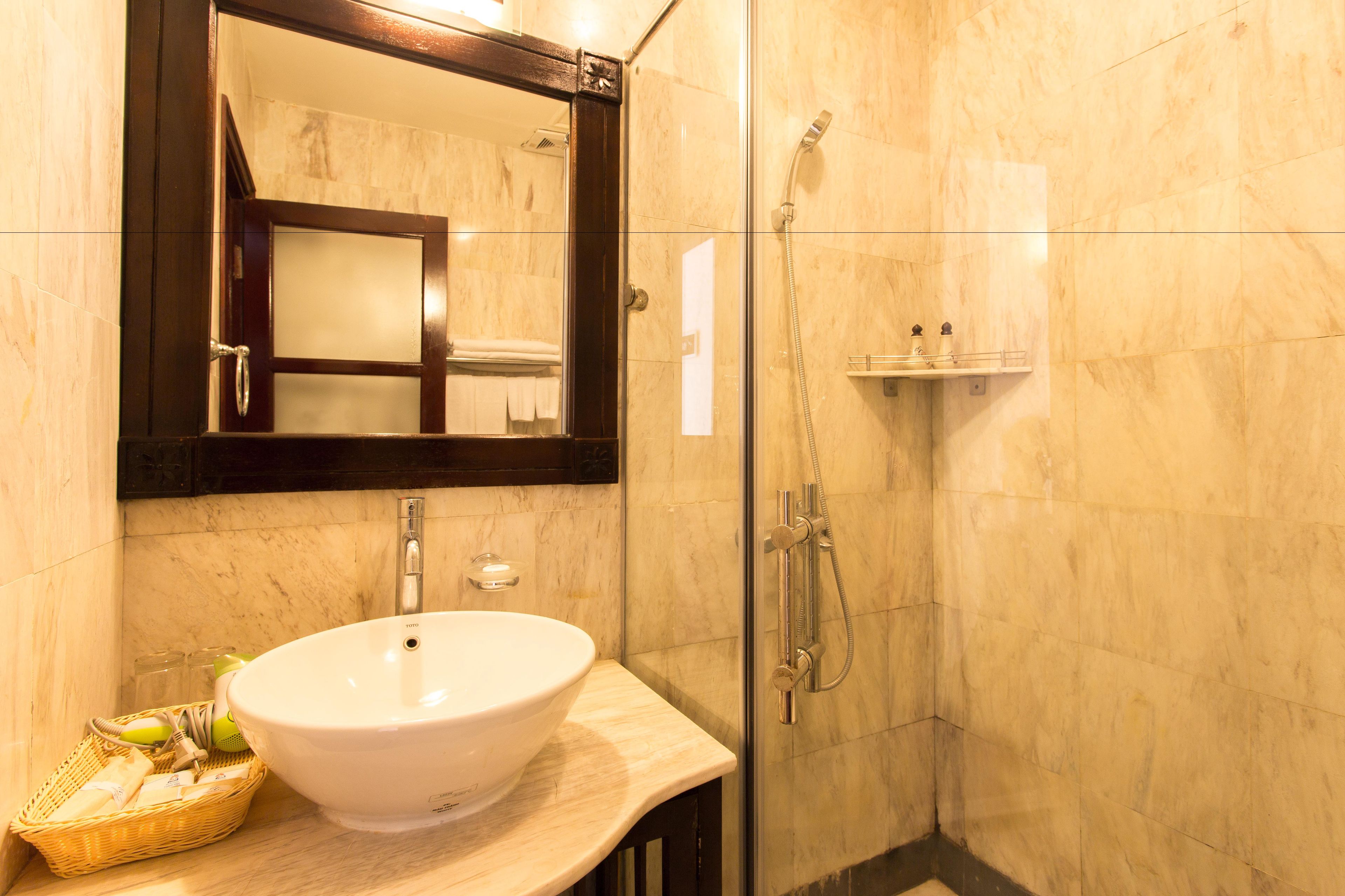 shower, hair dryer, slippers, towels