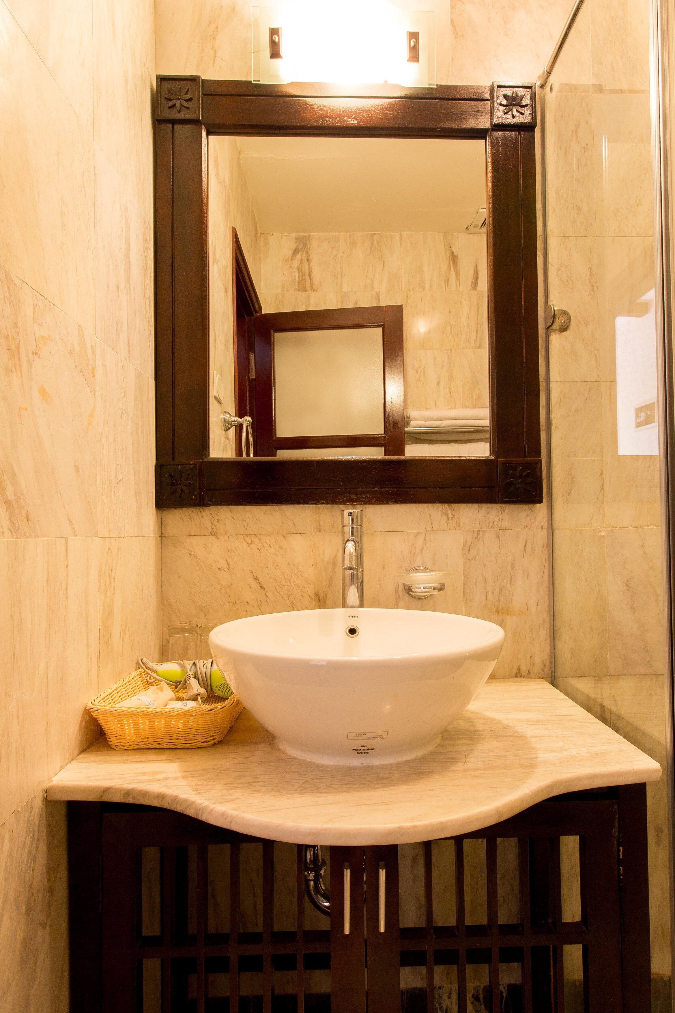 shower, hair dryer, slippers, towels