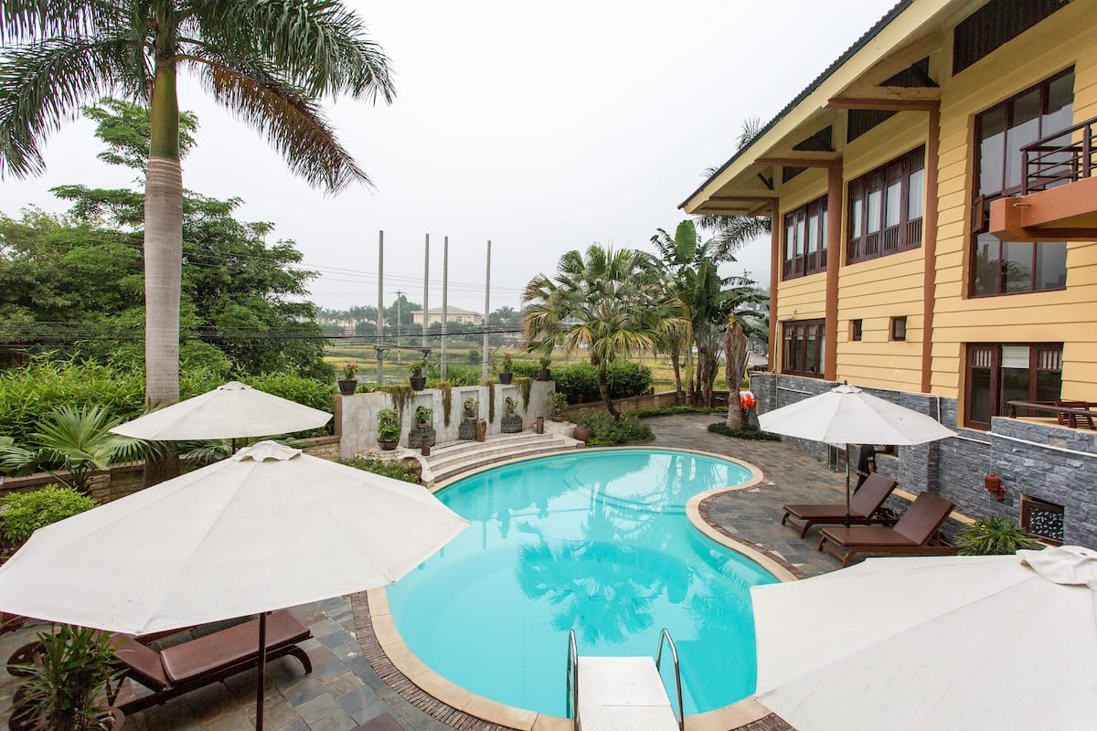 outdoor pool, pool umbrellas, pool loungers