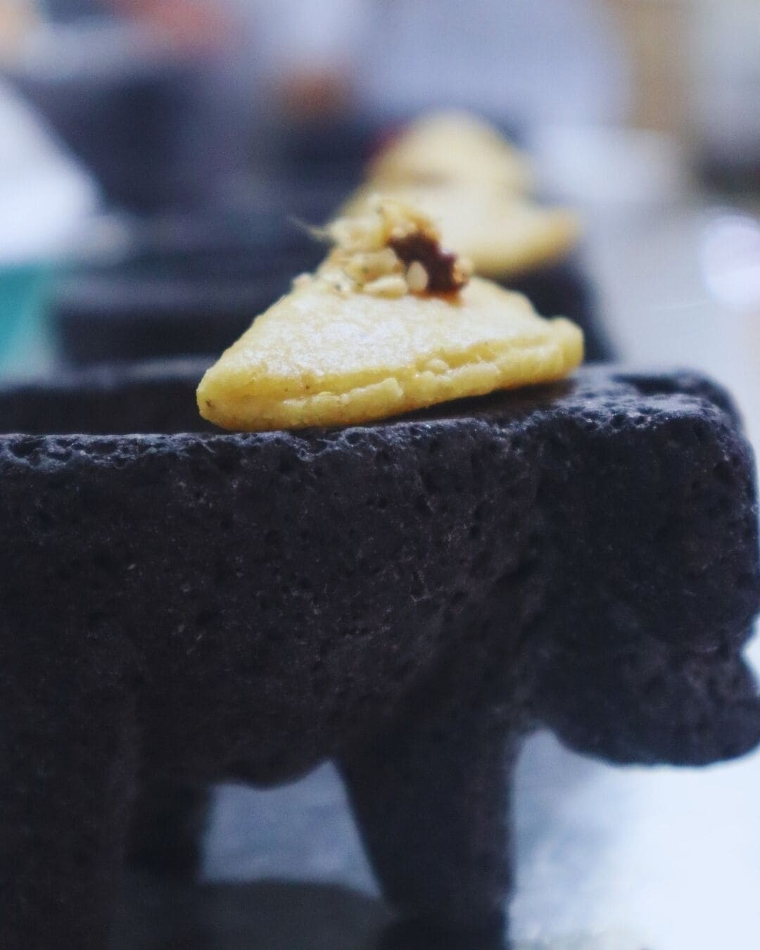 A close-up of a dessert on a black surface.
