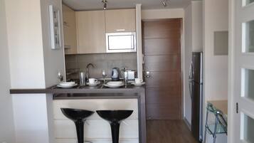 Fridge, microwave, cookware/dishes/utensils