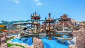 A water park with multiple water slides and a central pool.