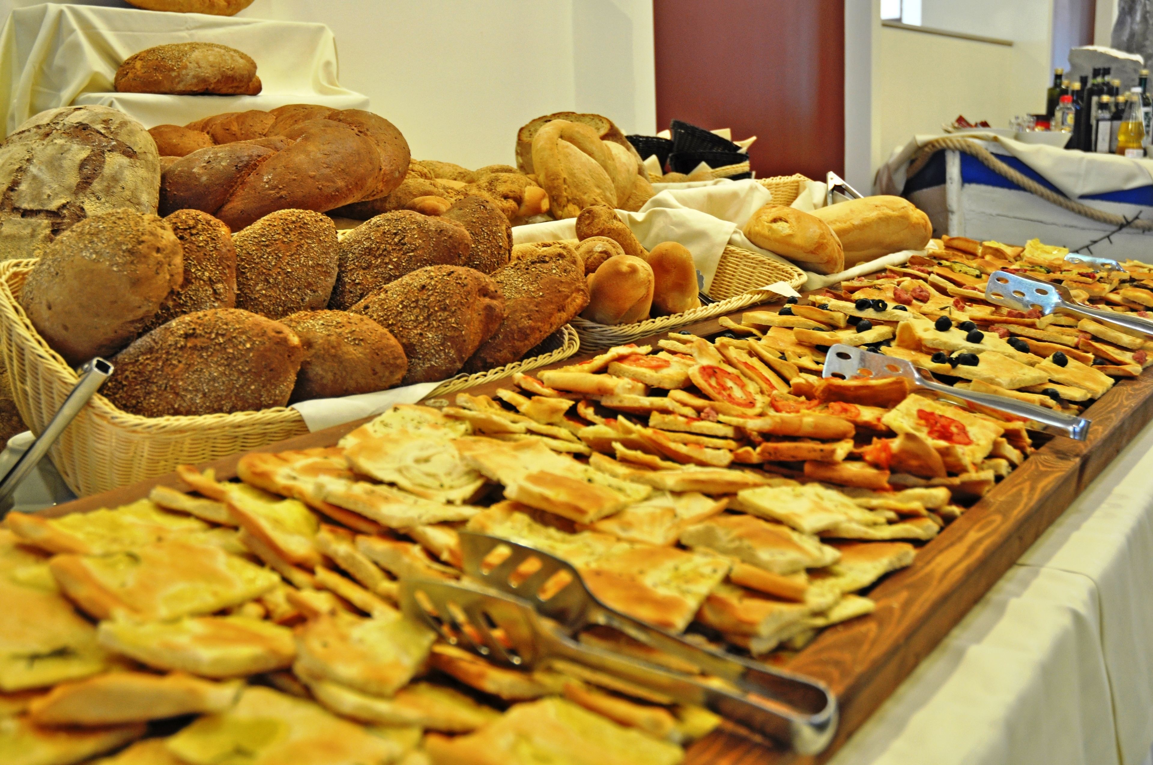 A buffet with various breads and flatbreads.