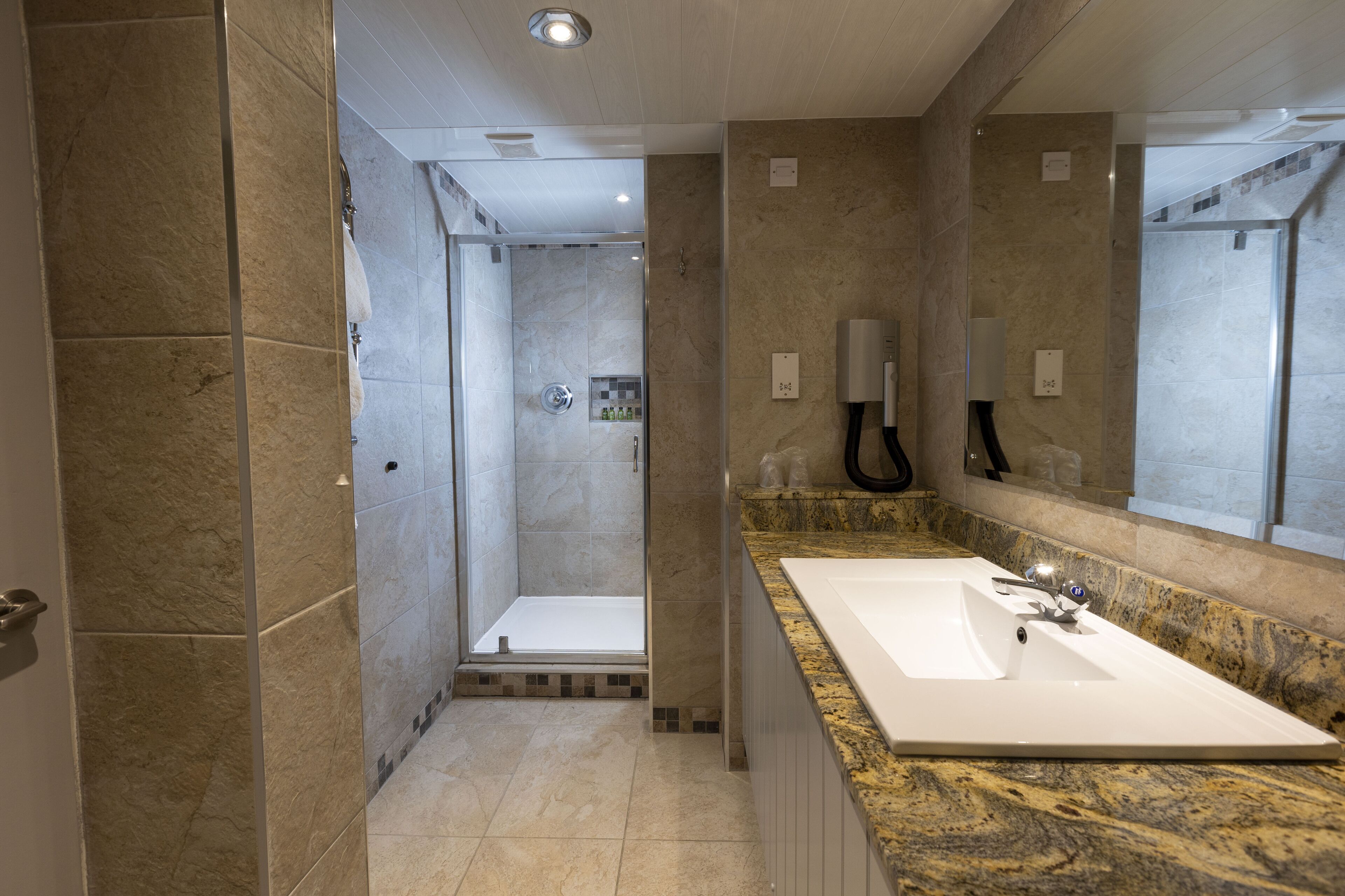 superior room, 1 king bed, non smoking, kitchenette (walk-in shower) | bathroom | combined shower/bathtub, free toiletries, hair dryer, towels