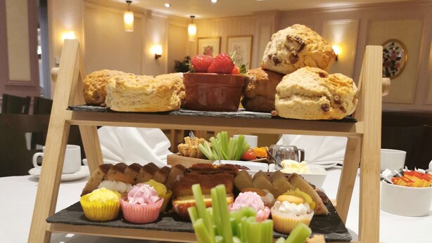 A buffet setup with various food items including pastries, fruits, and dips. - Best Western Manor Hotel (Gravesend)
