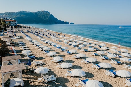 Sun-loungers, beach umbrellas. Taç Premier Hotel & Spa