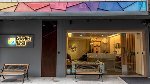 The exterior of the ColorMix Hotel with a reception area visible through the glass doors. - ColorMix Hotel & Hostel (Taipei)