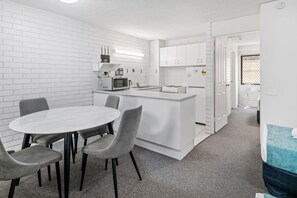 Full-size fridge, microwave, stovetop, coffee/tea maker