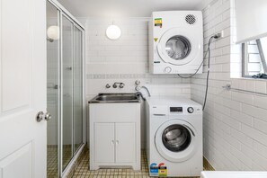 Shower, hair dryer, towels, shampoo
