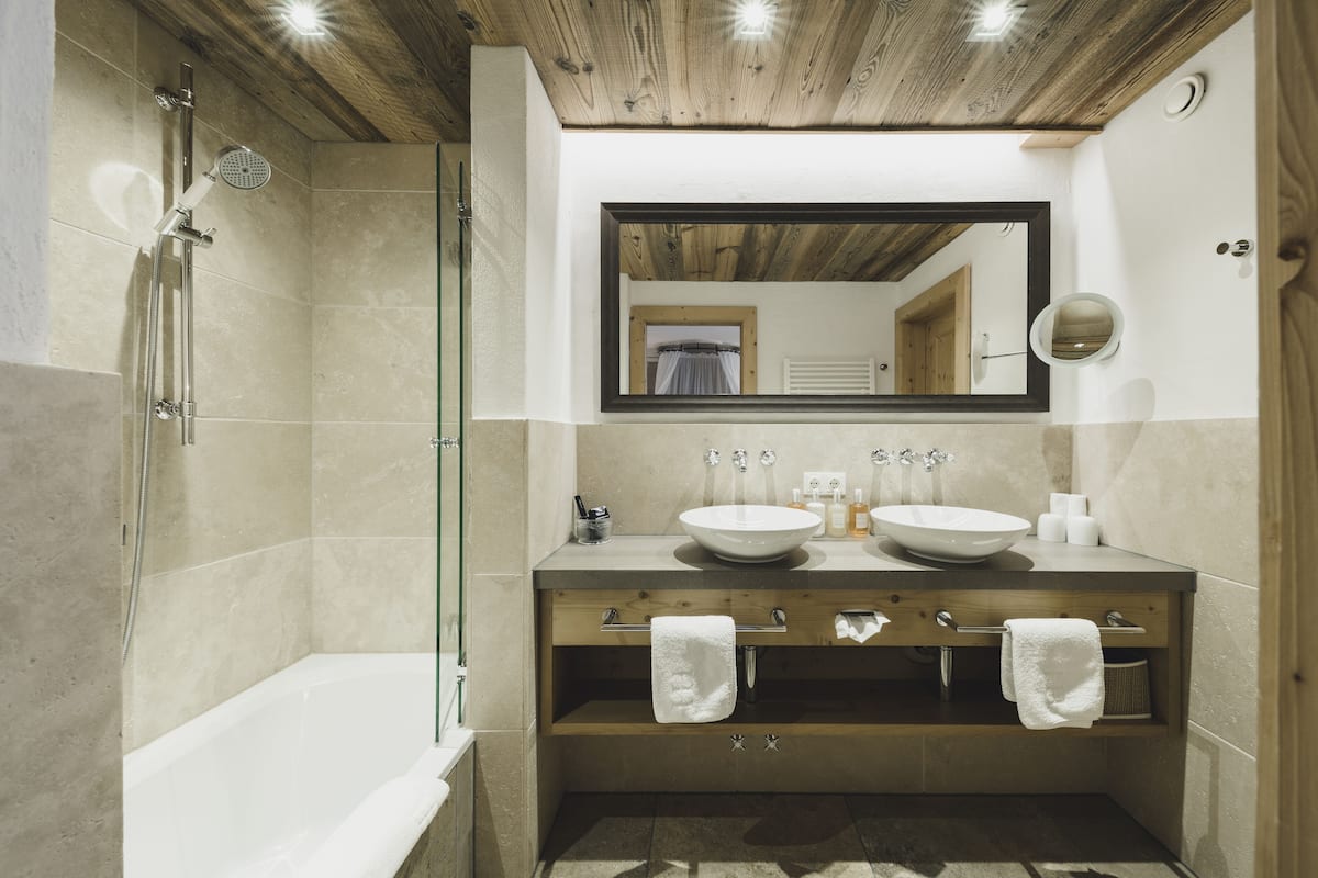 suite, 2 bedrooms | bathroom | rainfall showerhead, designer toiletries, hair dryer, bathrobes