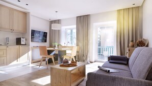 A modern living room with a sofa, coffee table, and dining area.