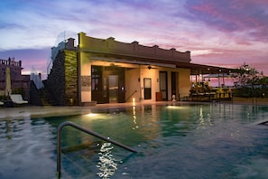 Outdoor pool, open 10:00 AM to 8:00 PM, pool umbrellas