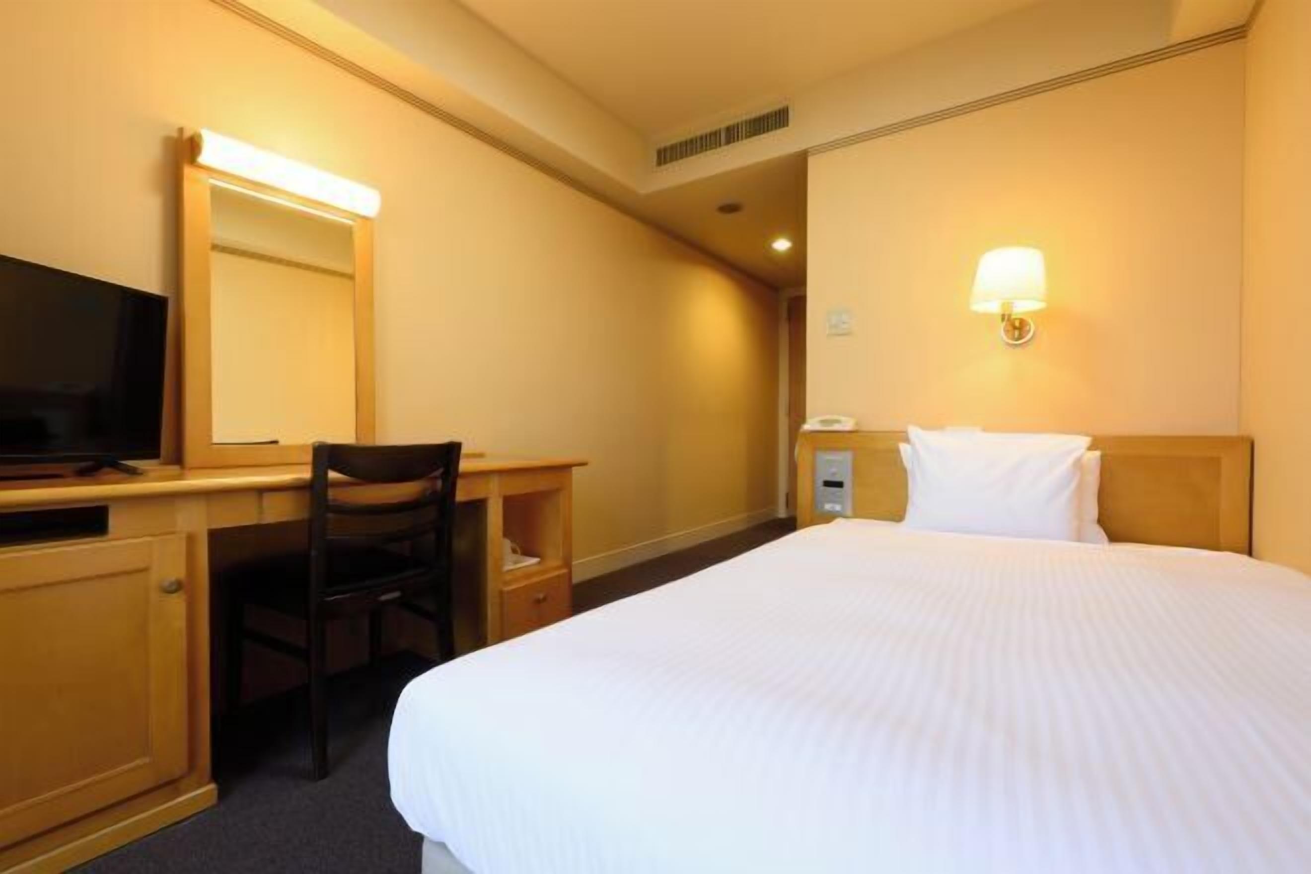 Desk, blackout curtains, iron/ironing board, bed sheets