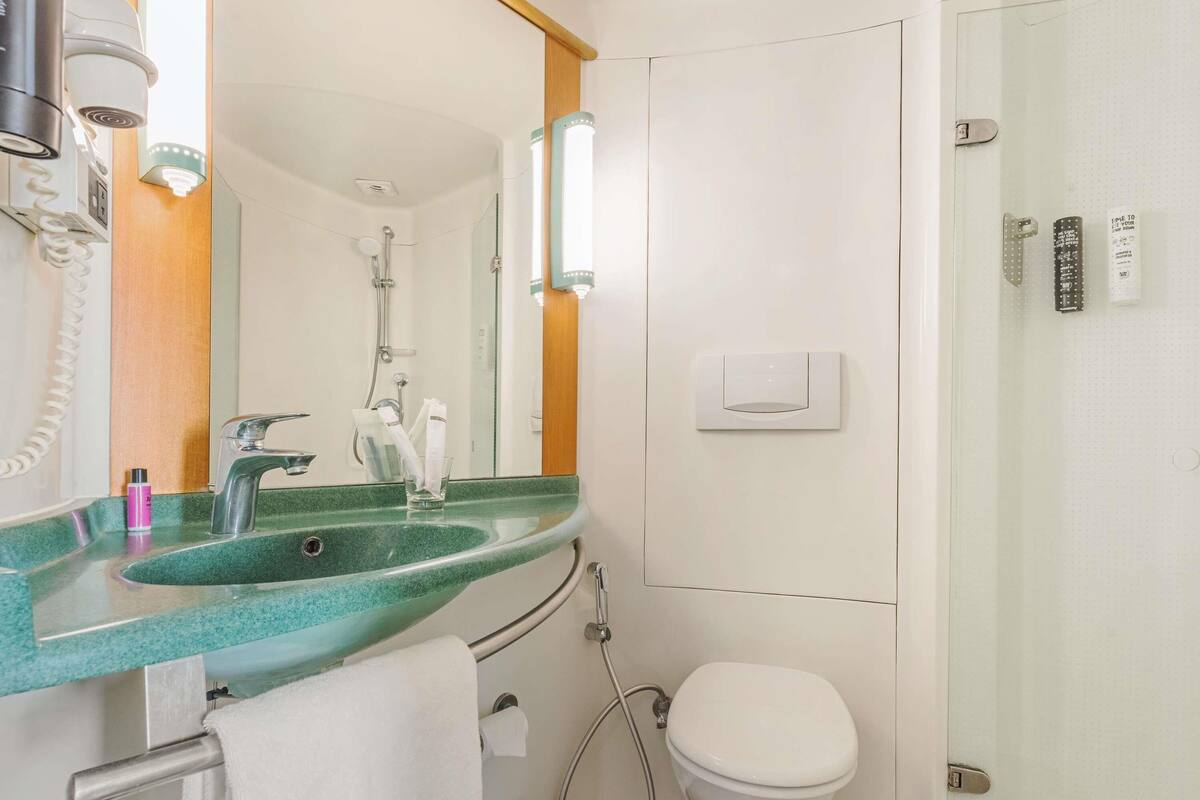 Shower, hydromassage showerhead, eco-friendly toiletries, hair dryer