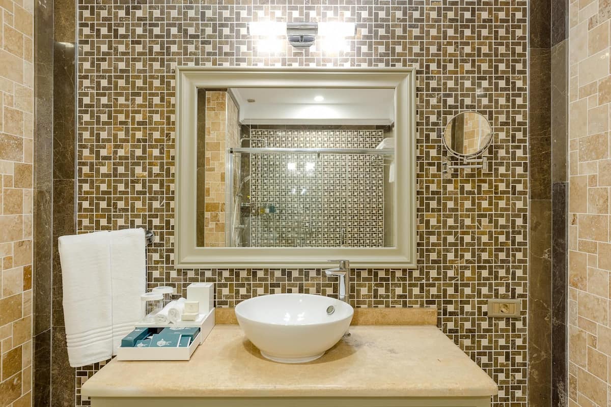 business suite | bathroom | free toiletries, hair dryer, bathrobes, slippers