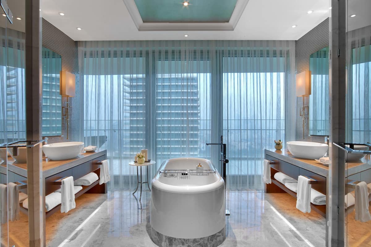separate bathtub and shower, deep-soaking bathtub, designer toiletries