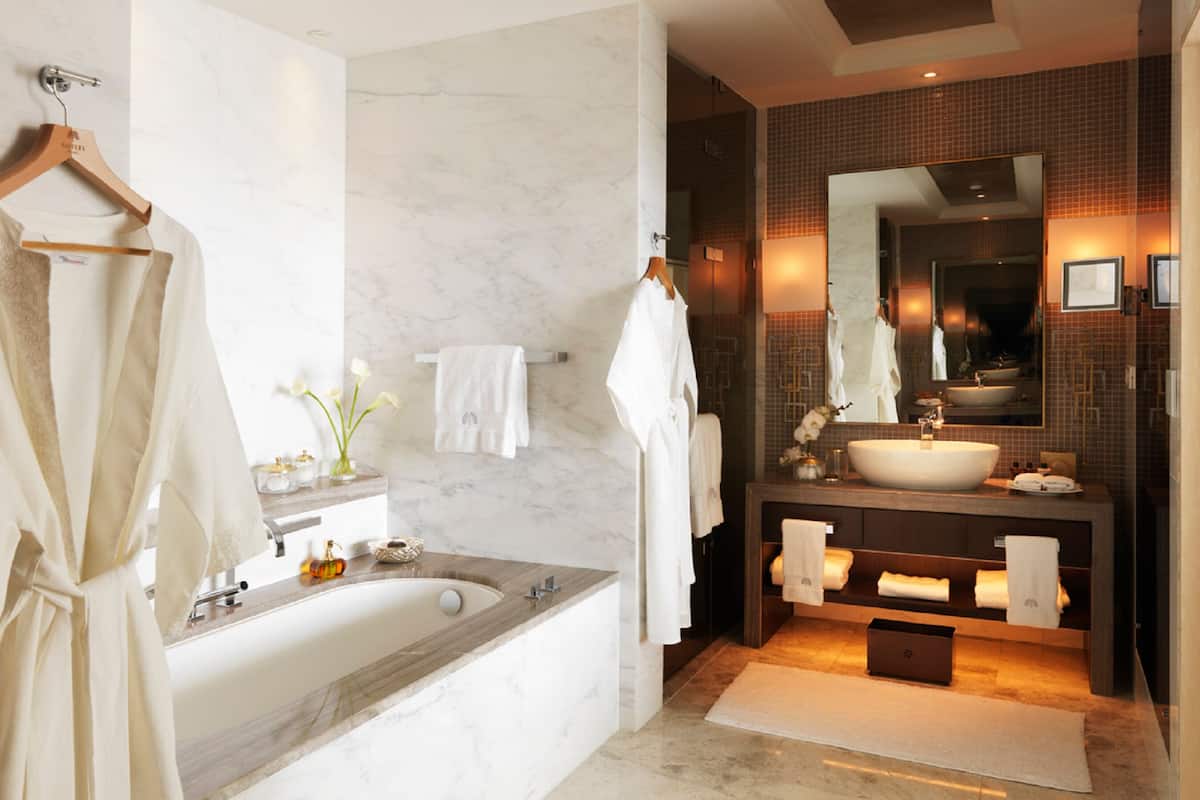 separate bathtub and shower, deep-soaking bathtub, designer toiletries
