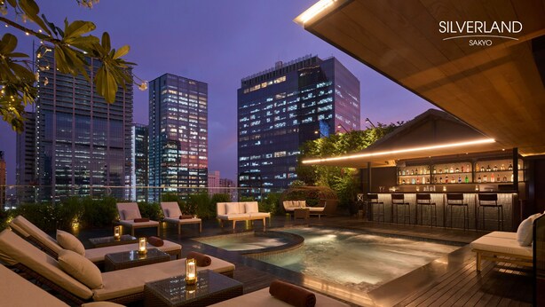 A rooftop bar with a pool, lounge chairs, and a bar area with stools. - Silverland Sakyo Hotel & Spa (Ho Chi Minh City)