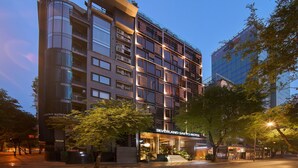 A multi-story hotel with a modern design, featuring balconies, large windows, and a prominent signage for the Silverland Sakyo Hotel. - Silverland Sakyo Hotel & Spa (Ho Chi Minh City)
