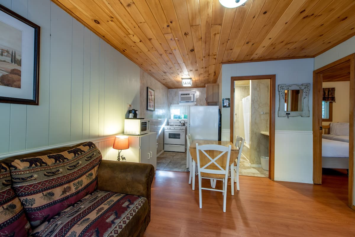 2 Bedroom Suite, Deck, Kitchen | Living area | 43-inch flat-screen TV with cable channels