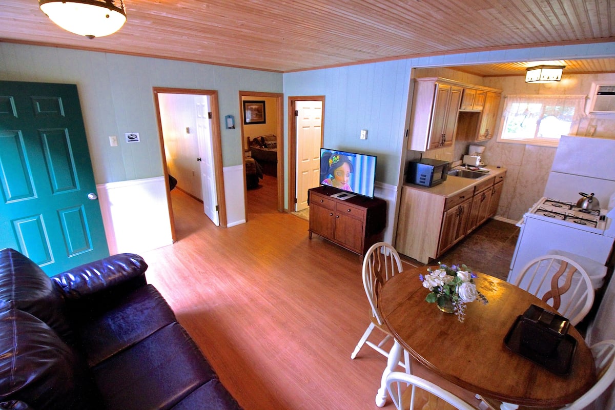 Premier 2 Bedroom Suite, Deck, Kitchen | Living area | 43-inch flat-screen TV with cable channels