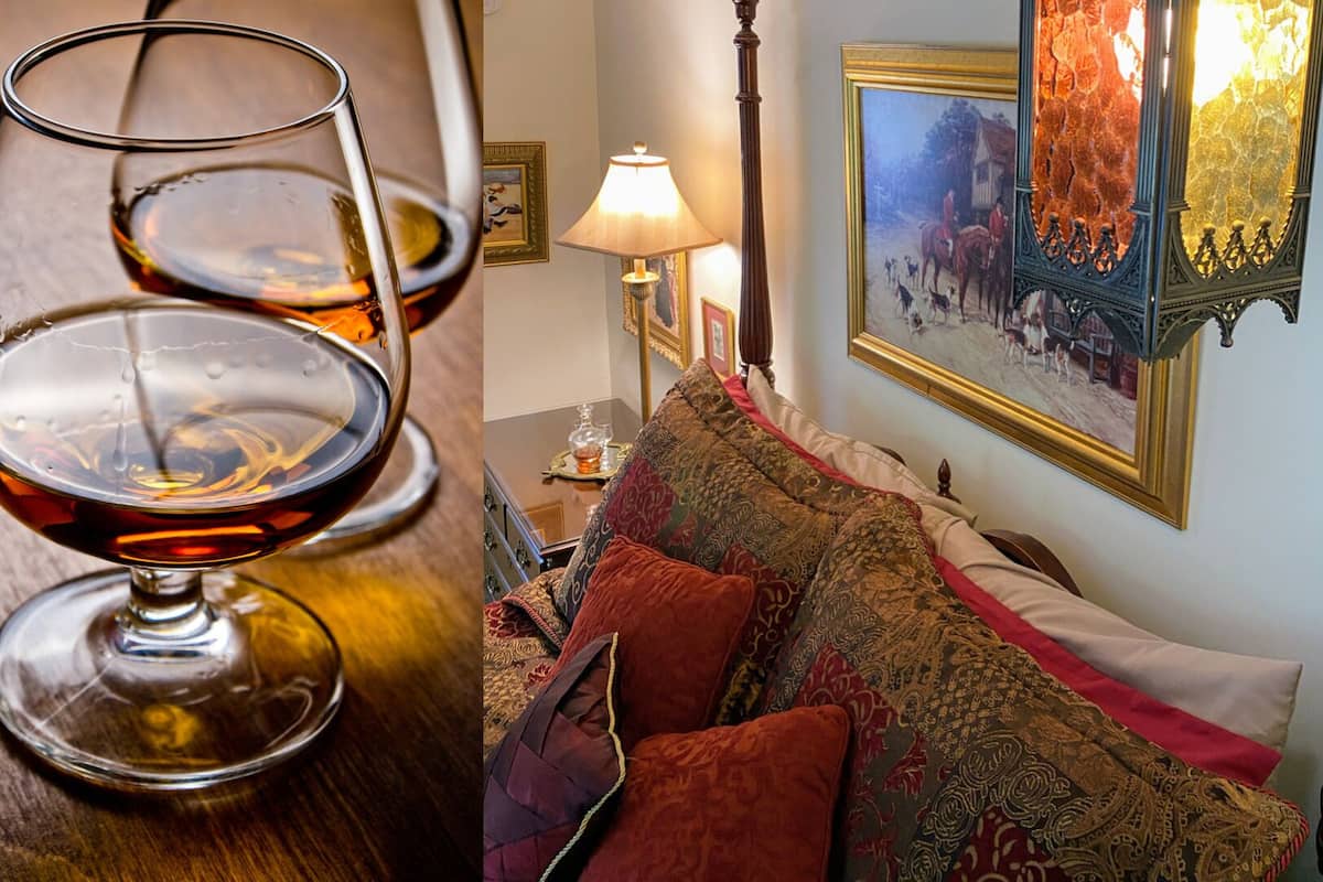 A room with a bed, a lamp, and a painting on the wall.