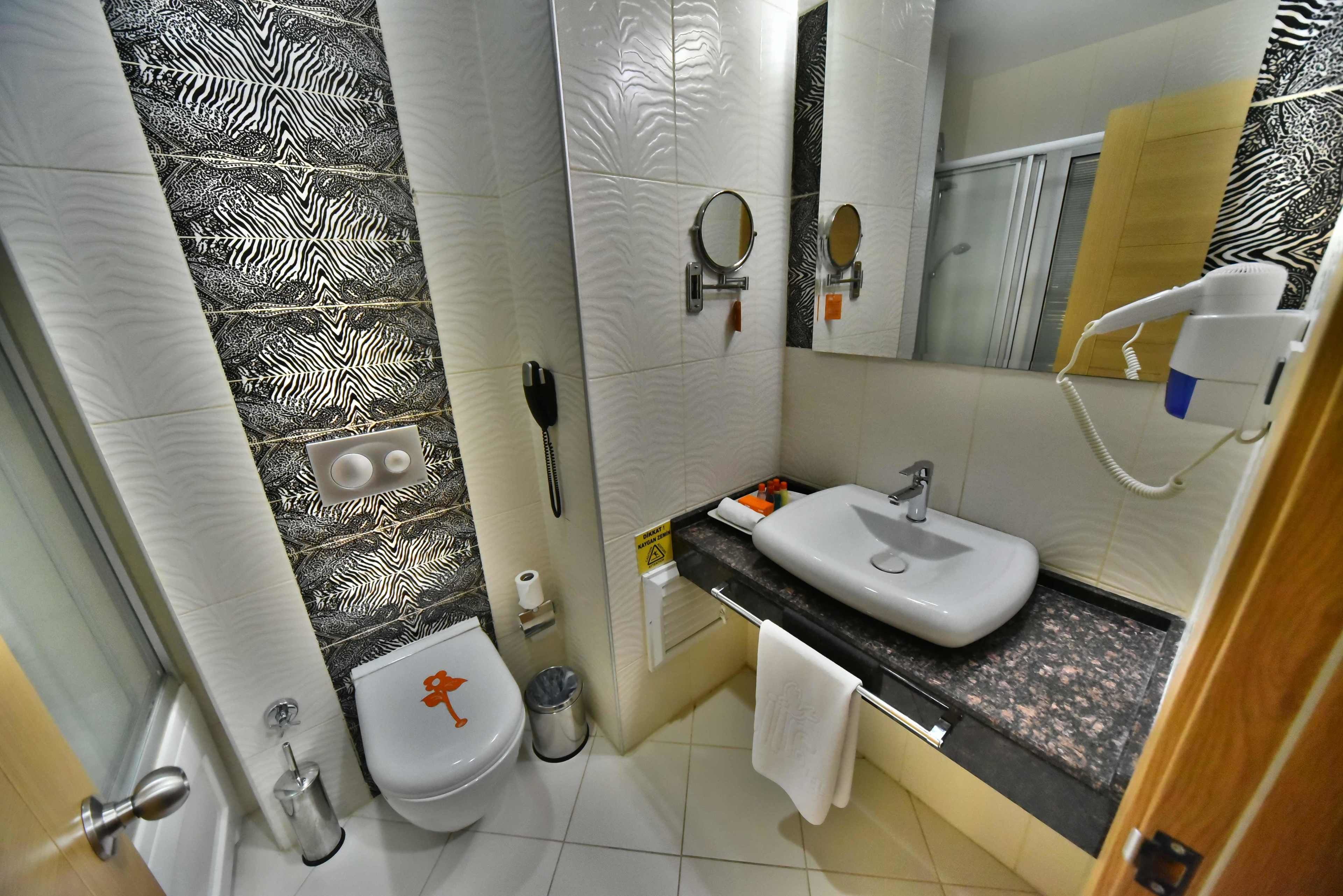 deep-soaking bathtub, free toiletries, hair dryer, slippers
