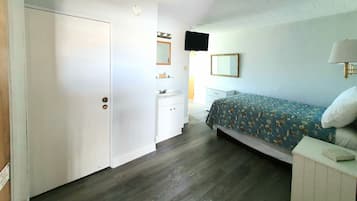 Apartment, 1 Bedroom, Kitchen, Partial Ocean View | Blackout drapes, iron/ironing board, travel crib, free WiFi