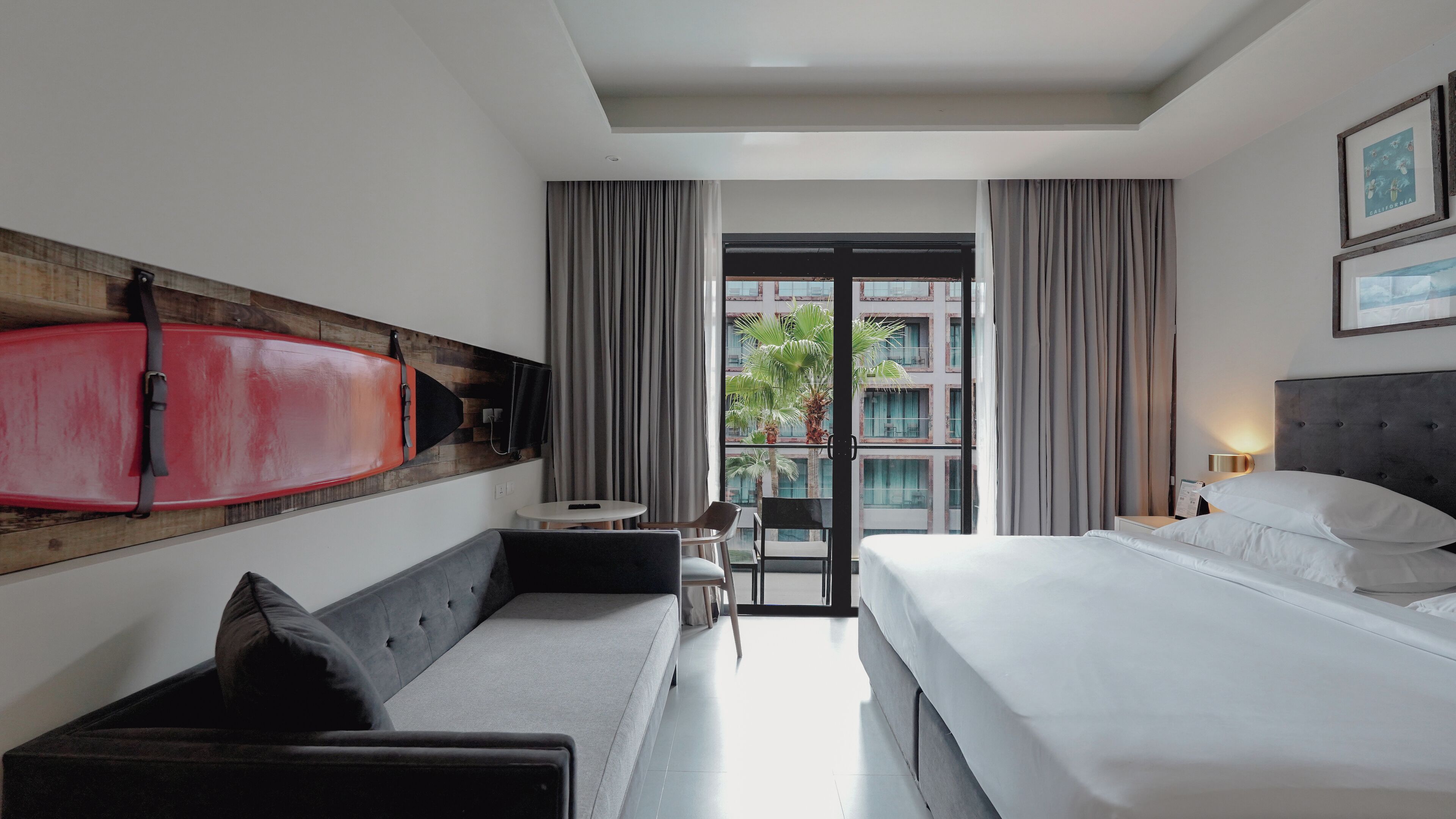 deluxe room, pool view | in-room safe, desk, blackout curtains, iron/ironing board