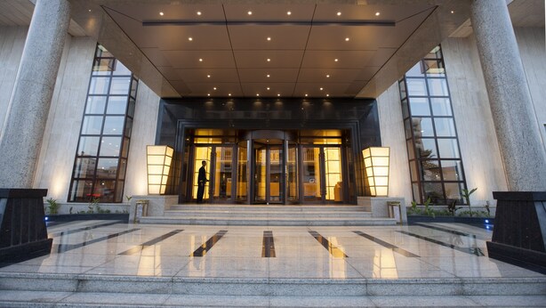 A hotel entrance with a grand facade, large glass doors, and a well-lit interior. - Boudl AL Tahlia (Jeddah)