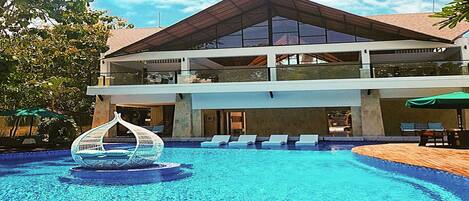 Outdoor pool, pool umbrellas, sun loungers